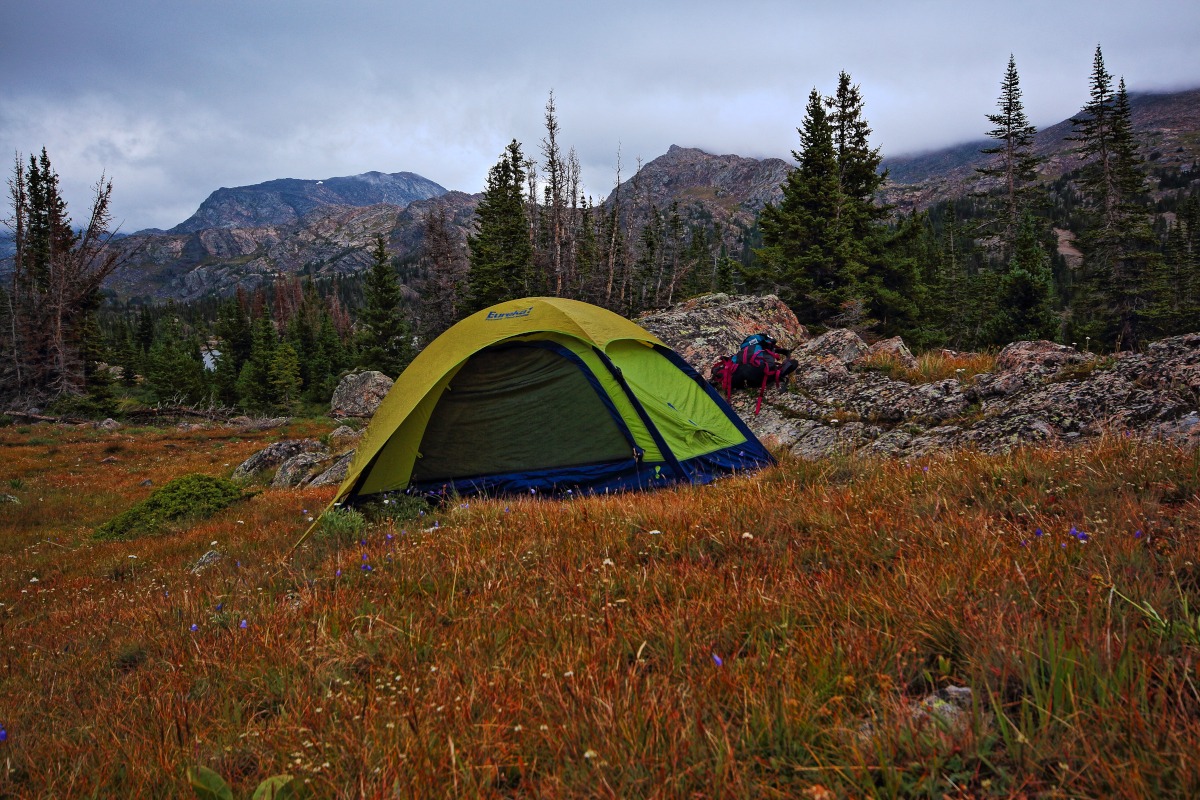 My camp in the Cloud Peak Wilderness of the Bighorn National Forest showing my tent and my gear unpacked on a nearby boulder